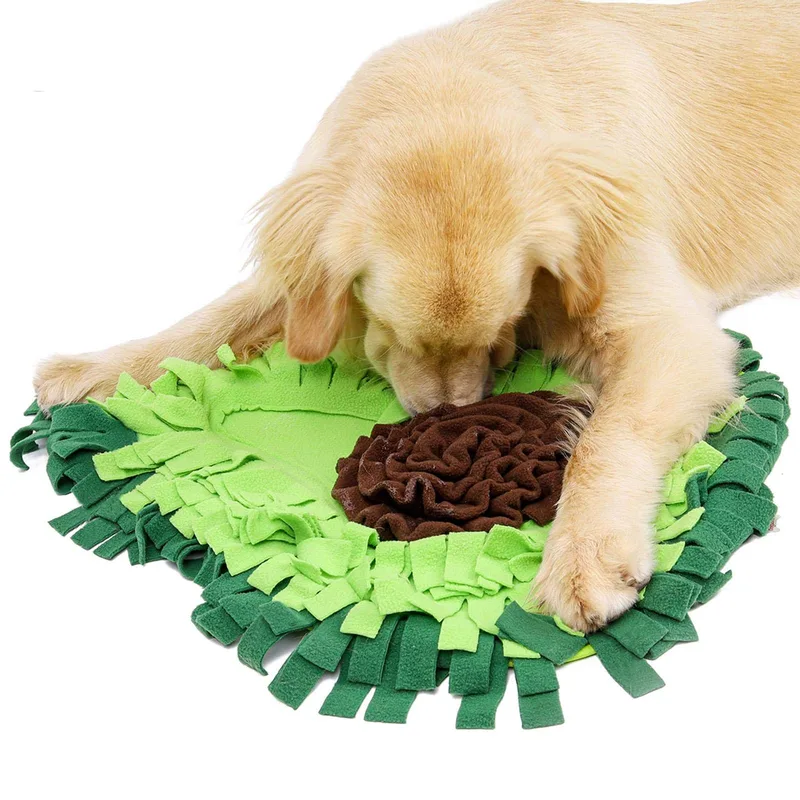 Dog nosing through the folds of the snuffle mat